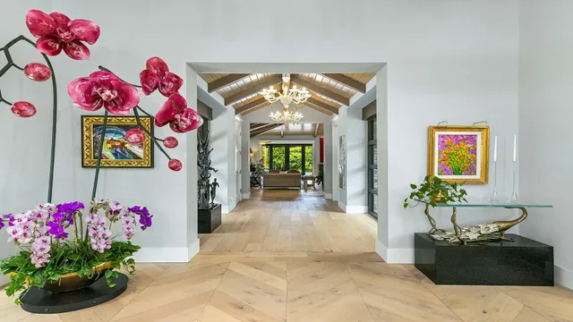 a view of a hallway and wooden floor