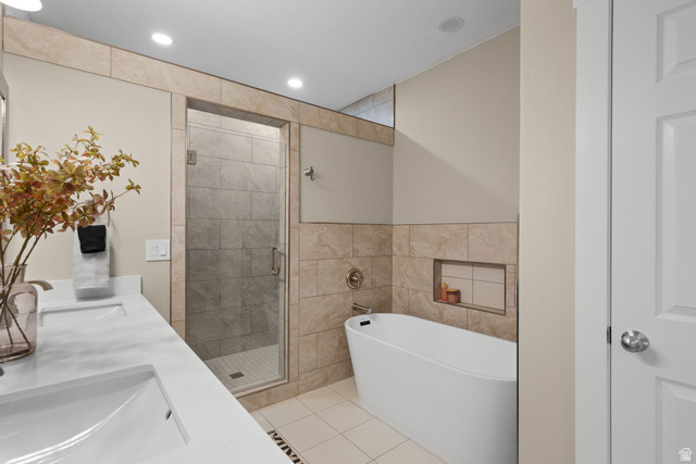 1570 South Rio Virgin Drive Washington, UT 84780 - Photo 31 of 71 Bathroom with a shower stall, a freestanding bath, double vanity, tile walls, and recessed lighting