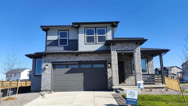 a front view of a house with yard