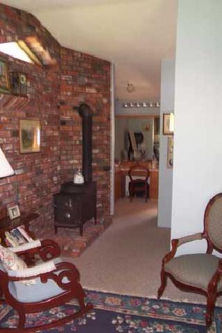 1191 Stone Road Yakima, WA 98908 - Photo 5 of 7 a living room with furniture and a fireplace