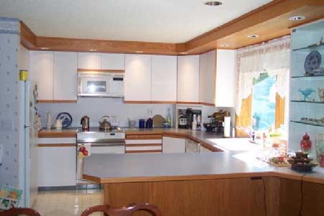 1191 Stone Road Yakima, WA 98908 - Photo 6 of 7 a kitchen with sink cabinets and appliances