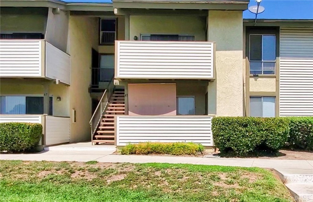 6351 Riverside Drive, Unit 46 Chino, CA 91710 - Photo 1 of 1 a view of a house with a yard
