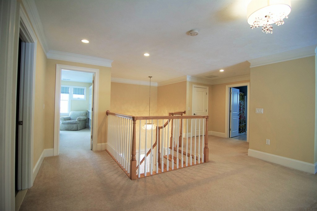 30 Nobscot Road, Unit 24 Sudbury, MA 01776 - Photo 18 of 24 a view of a hallway with closet area