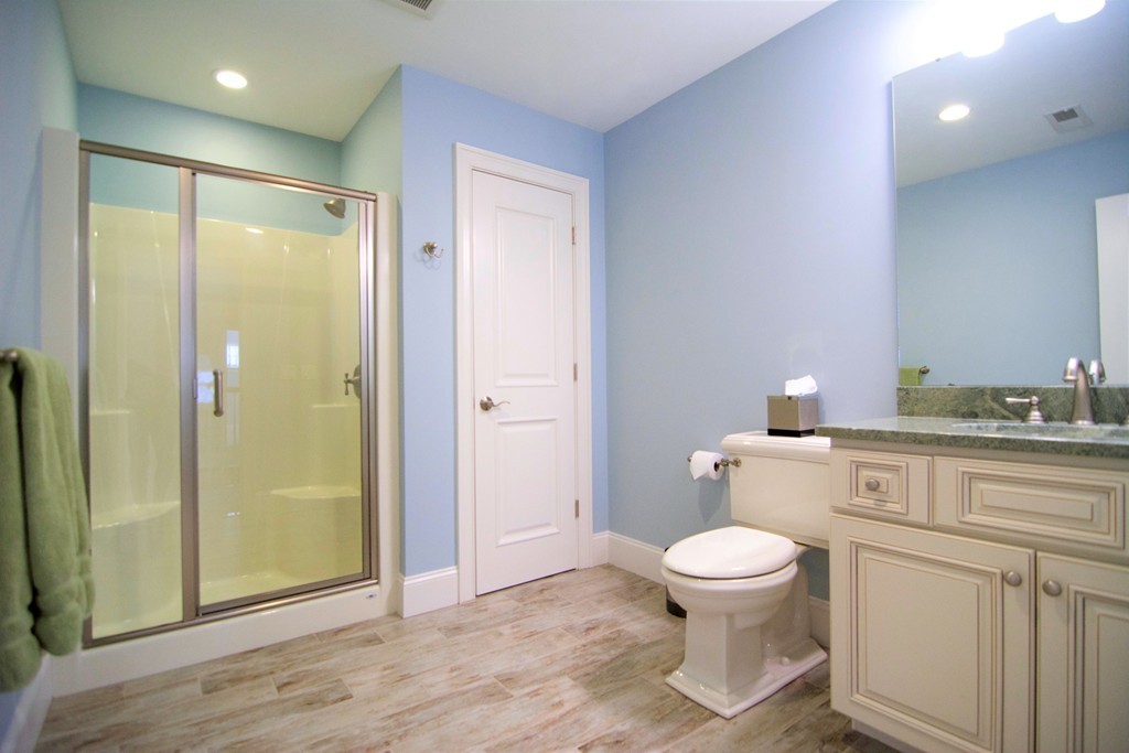 30 Nobscot Road, Unit 24 Sudbury, MA 01776 - Photo 19 of 24 a bathroom with a granite countertop sink a toilet and shower