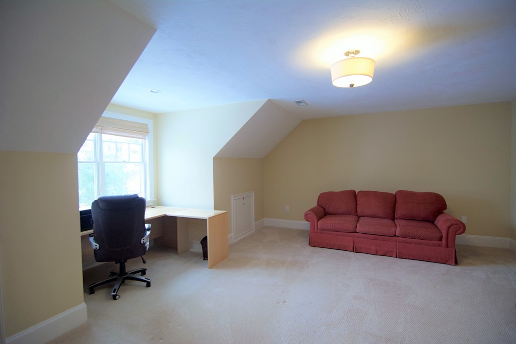 30 Nobscot Road, Unit 24 Sudbury, MA 01776 - Photo 20 of 24 a view of workspace with lounge chair