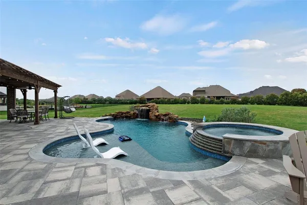 a view of a swimming pool from a lounge chair