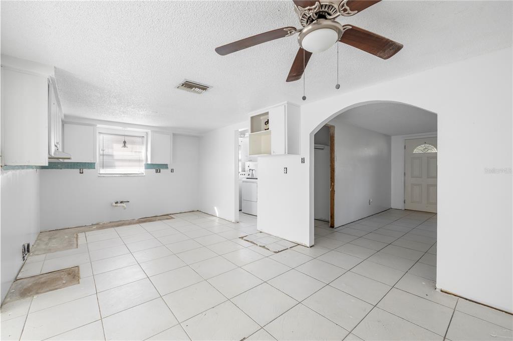 7840 Gulf Way Hudson, FL 34667 - Photo 11 of 44 a view of a kitchen with closet and a ceiling fan