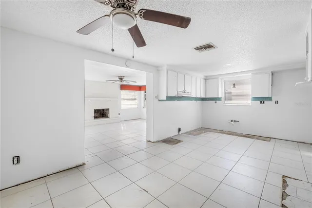 a view of kitchen with white cabinets