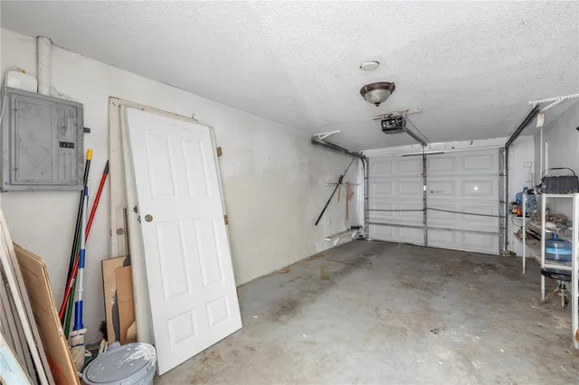 a view of a livingroom with a fireplace and window