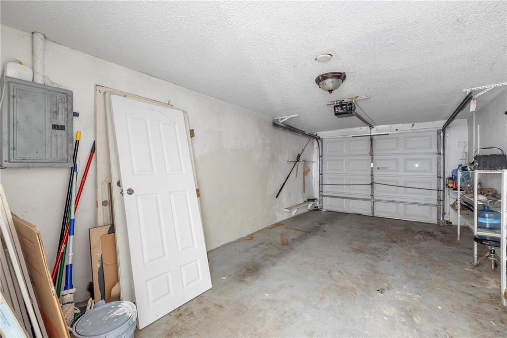 7840 Gulf Way Hudson, FL 34667 - Photo 16 of 44 a view of a garage with white walls