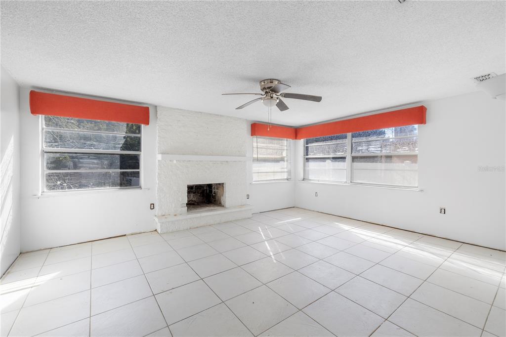 7840 Gulf Way Hudson, FL 34667 - Photo 17 of 44 a view of a livingroom with a fireplace and window