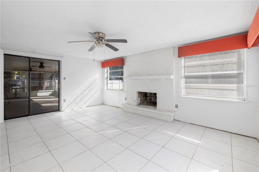 7840 Gulf Way Hudson, FL 34667 - Photo 18 of 44 a view of a livingroom with a fireplace and window