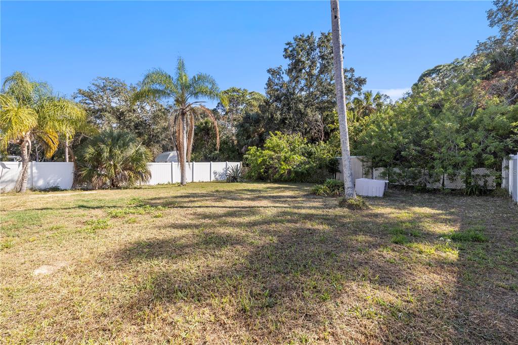 7840 Gulf Way Hudson, FL 34667 - Photo 25 of 44 a view of a yard with a house