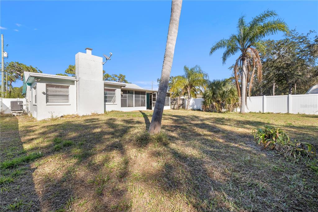 7840 Gulf Way Hudson, FL 34667 - Photo 26 of 44 a view of a house with a yard
