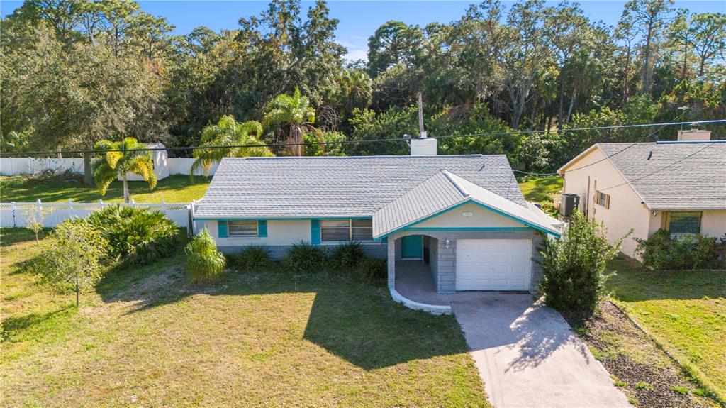 7840 Gulf Way Hudson, FL 34667 - Photo 33 of 44 a aerial view of a house with a yard and potted plants