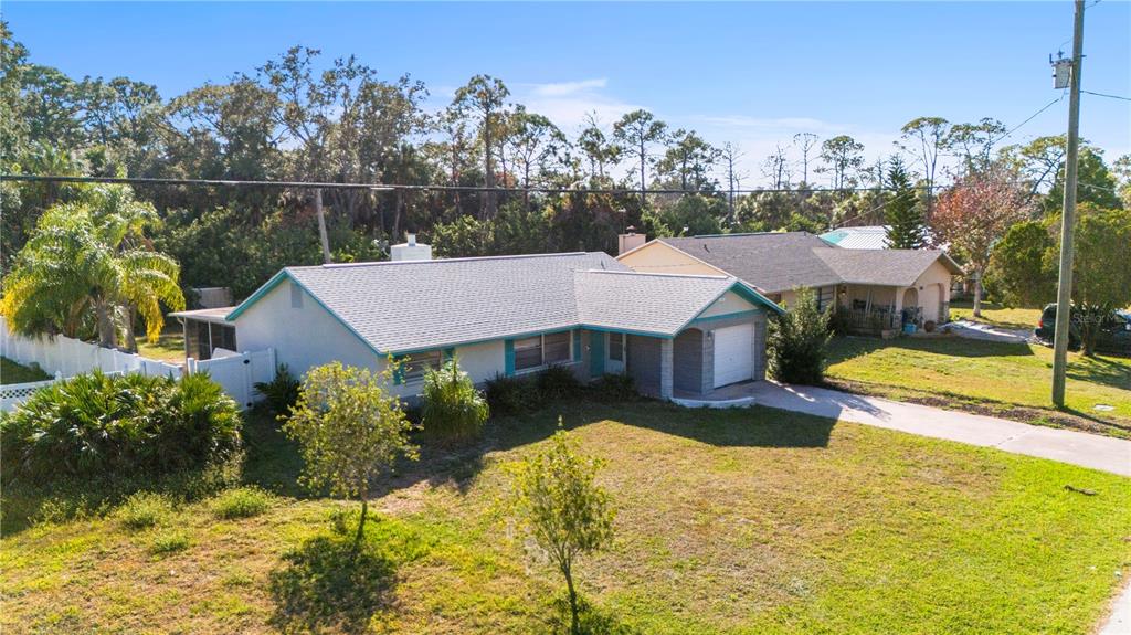 7840 Gulf Way Hudson, FL 34667 - Photo 34 of 44 a view of a house with pool and a yard