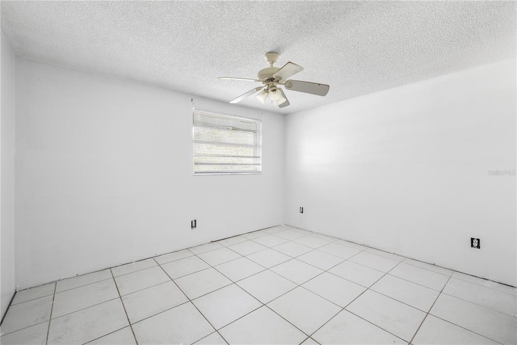 7840 Gulf Way Hudson, FL 34667 - Photo 4 of 44 a view of an empty room with a window