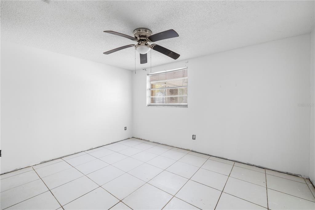 7840 Gulf Way Hudson, FL 34667 - Photo 6 of 44 a view of an empty room with a window