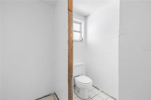 a bathroom with a toilet a sink and bathtub