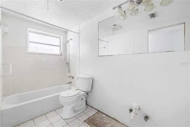 a view of a kitchen with closet and a ceiling fan