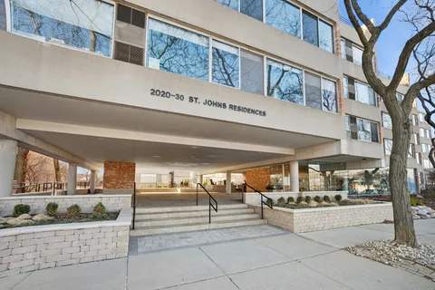 a view of a building with sitting area