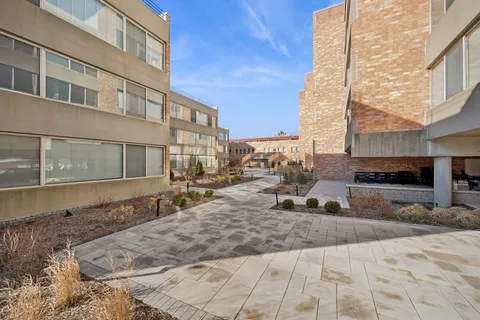 a view of a building with sitting area