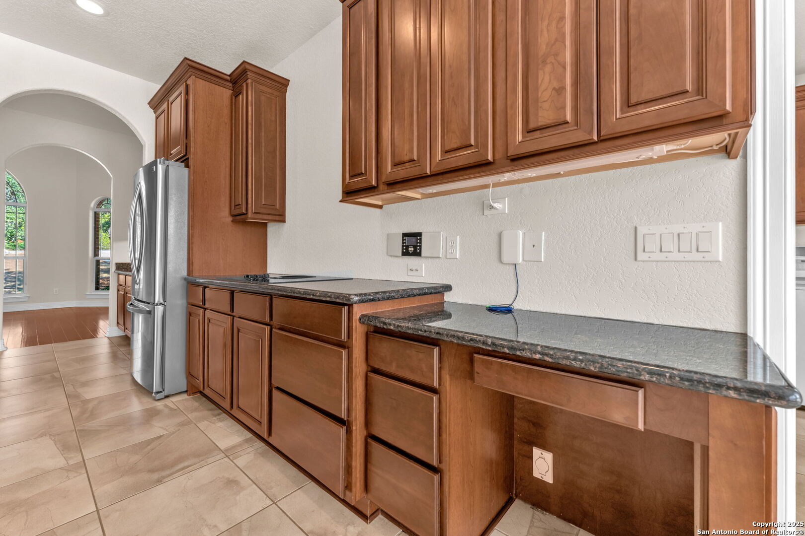 732 Private Road 1712 Mico, TX 78056 - Photo 14 of 50 a kitchen with stainless steel appliances granite countertop a refrigerator and a sink