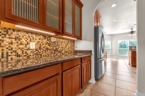a kitchen with stainless steel appliances a refrigerator and cabinets