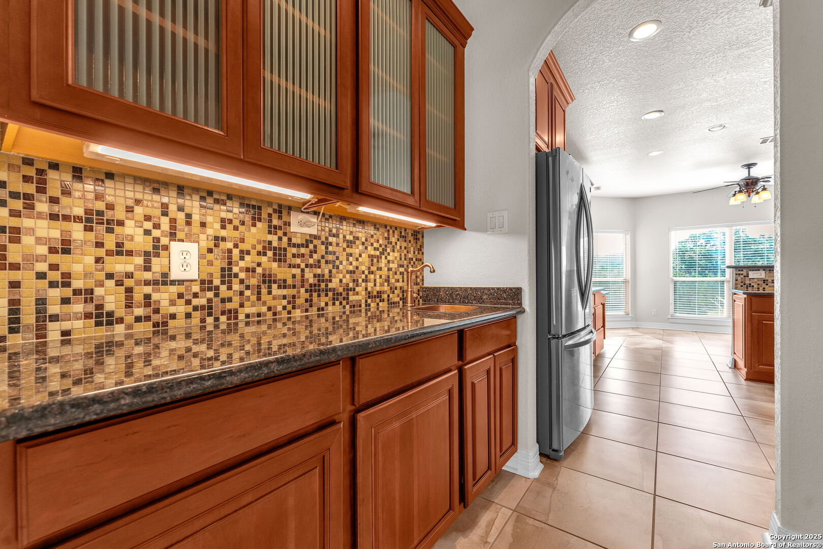 732 Private Road 1712 Mico, TX 78056 - Photo 17 of 50 a kitchen with stainless steel appliances a refrigerator and cabinets