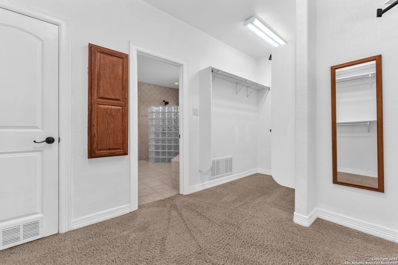 732 Private Road 1712 Mico, TX 78056 - Photo 31 of 50 an empty room with windows and closet