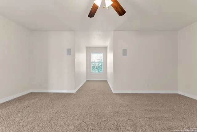 a room with a cabinets and a flat screen tv