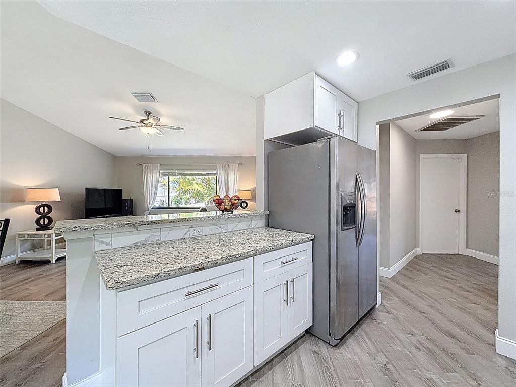 5384 Baldock Avenue Spring Hill, FL 34608 - Photo 30 of 51 a kitchen with stainless steel appliances granite countertop a refrigerator and a sink
