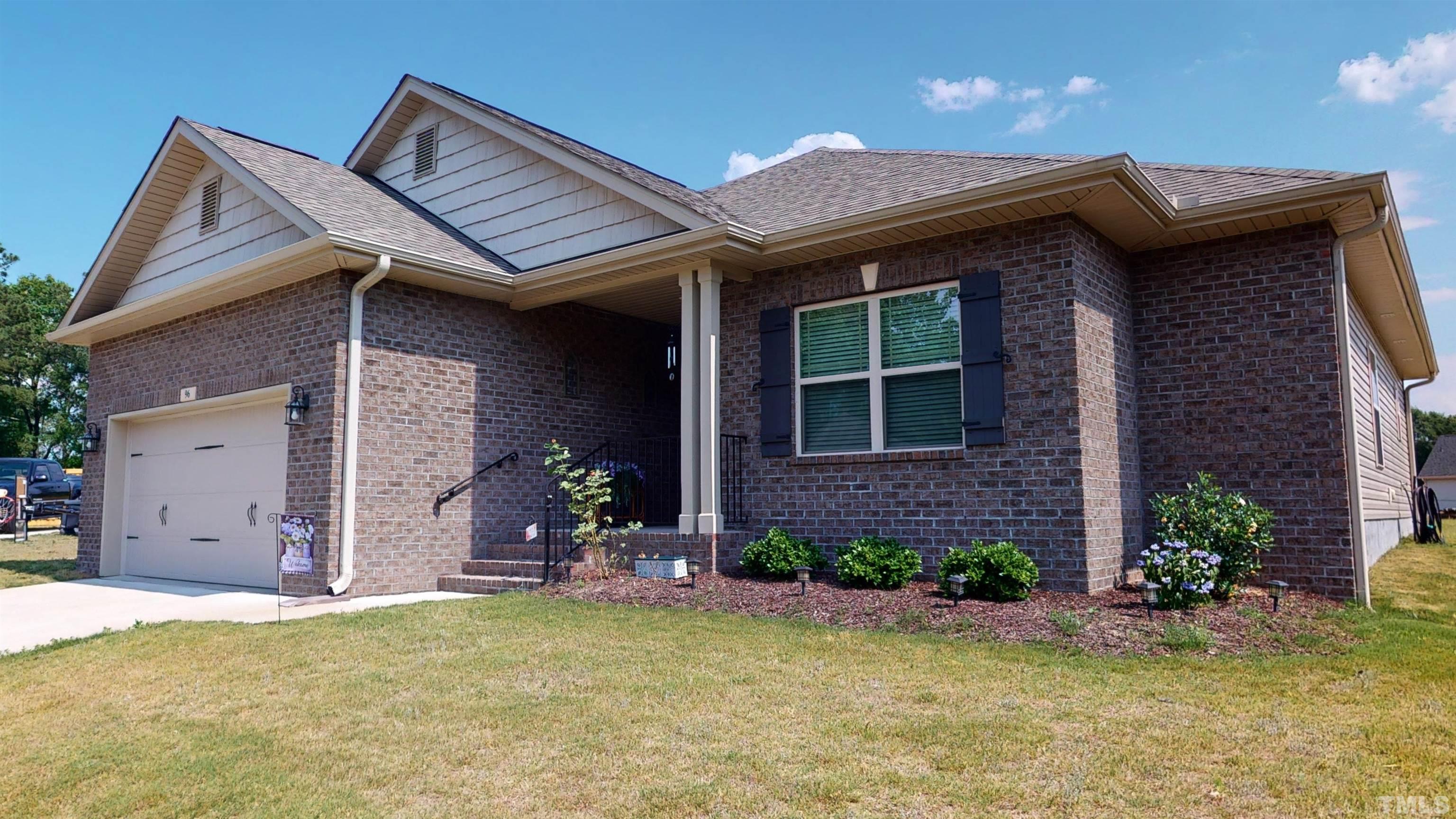 96 Longo Lane Benson, NC 27504 - Photo 1 of 51 a front view of a house with a yard