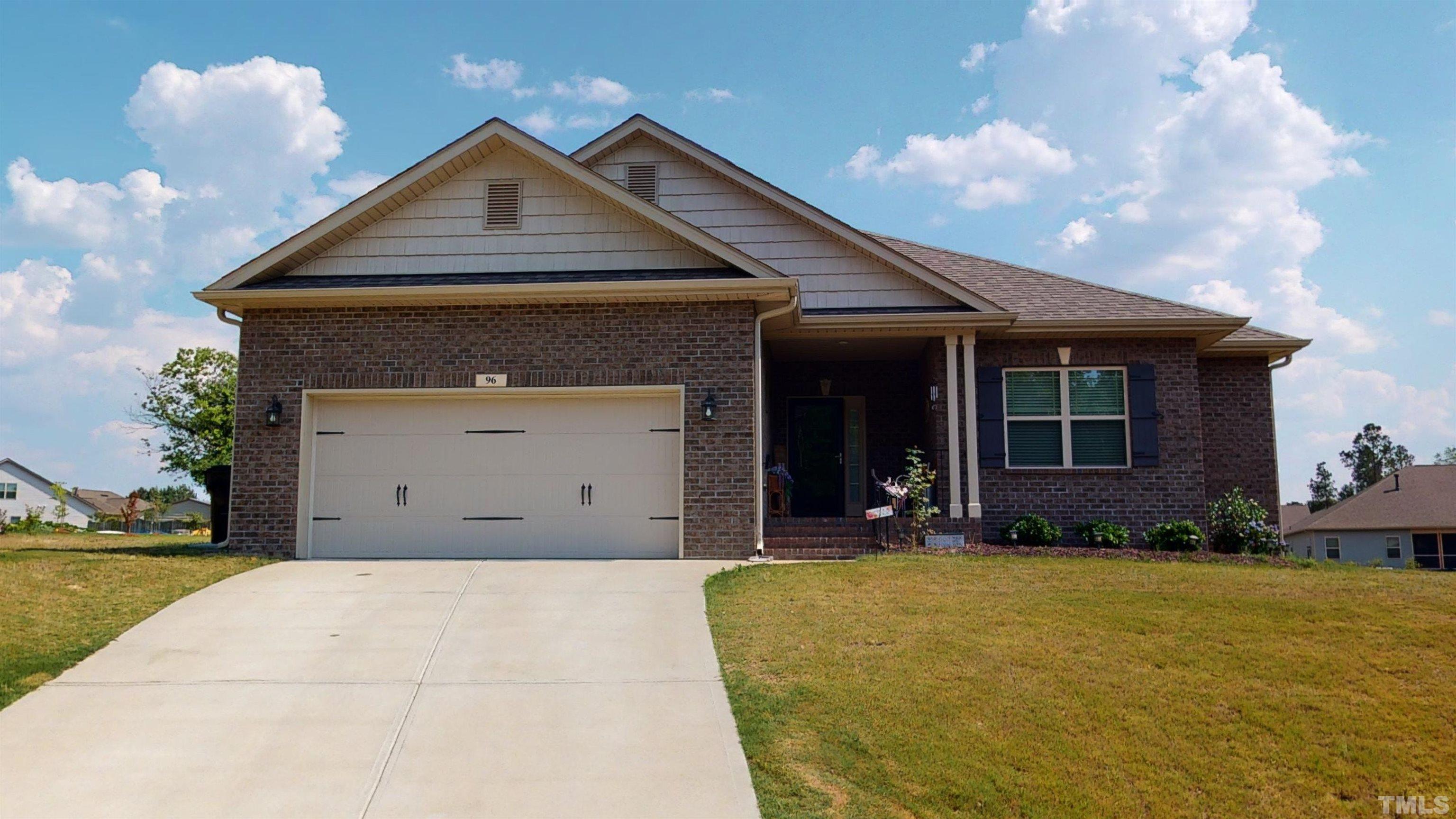 96 Longo Lane Benson, NC 27504 - Photo 2 of 51 a front view of a house with a yard