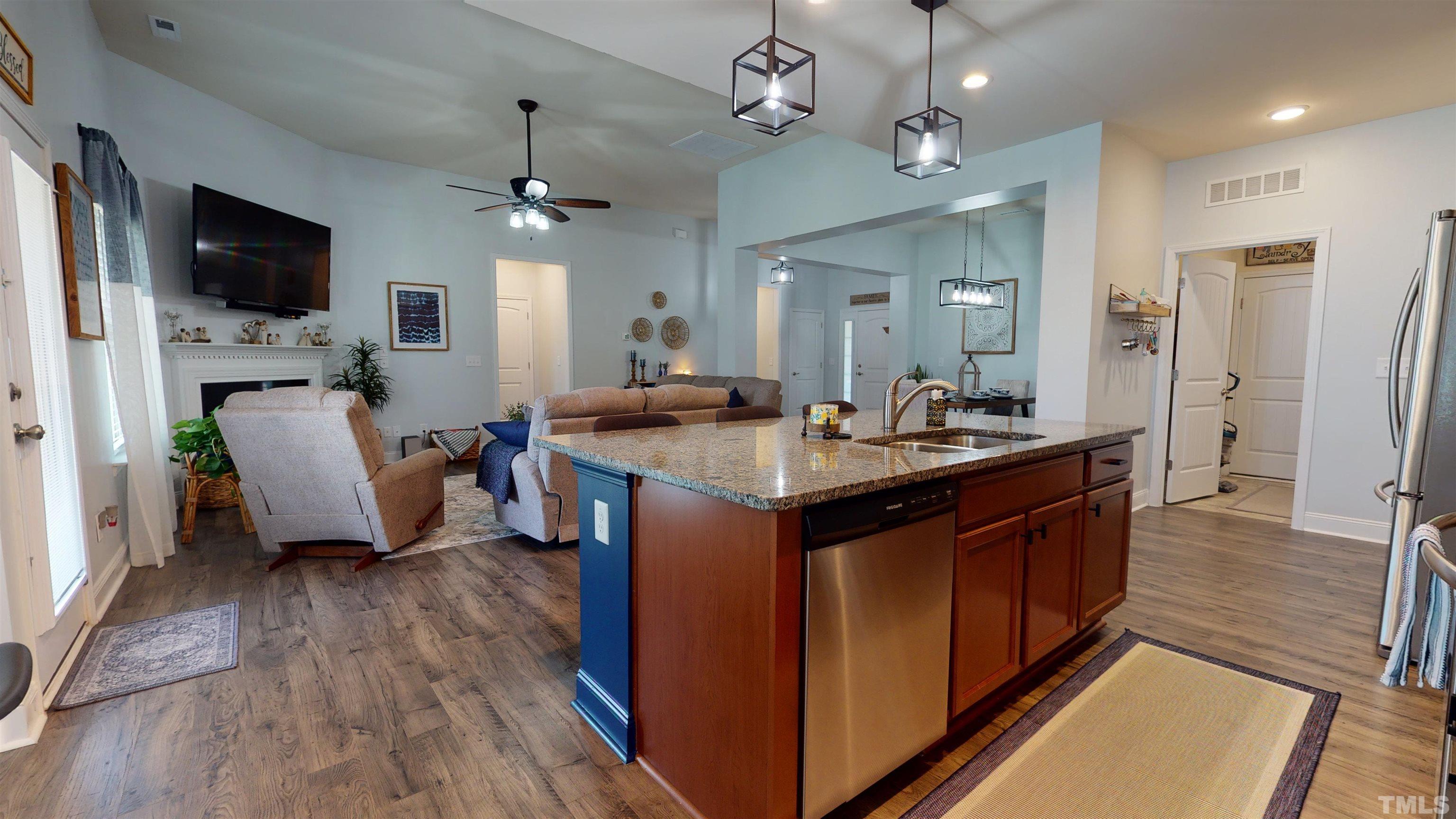 96 Longo Lane Benson, NC 27504 - Photo 27 of 51 a kitchen with a sink stove and wooden floor
