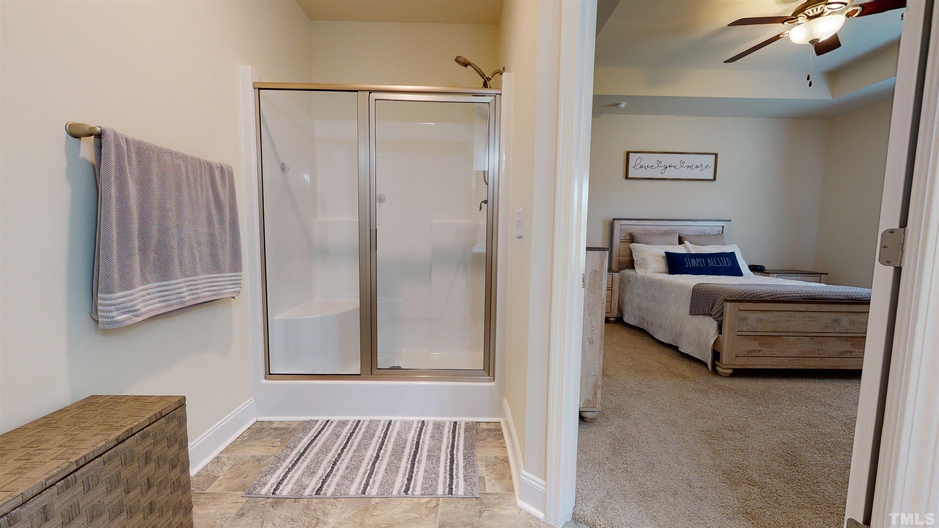 96 Longo Lane Benson, NC 27504 - Photo 30 of 51 a bedroom with a bed and a couch