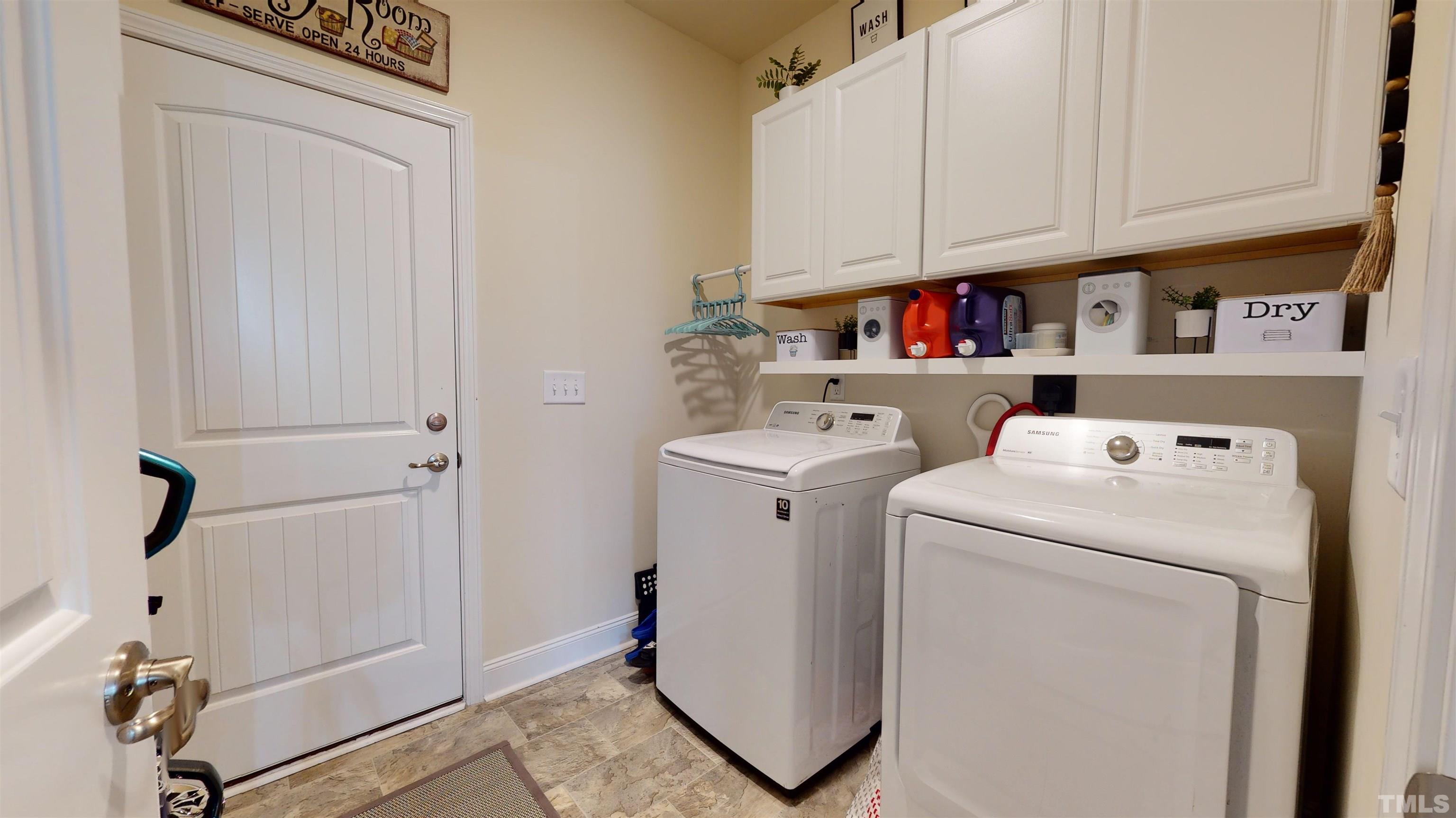 96 Longo Lane Benson, NC 27504 - Photo 38 of 51 a utility room with dryer and washer