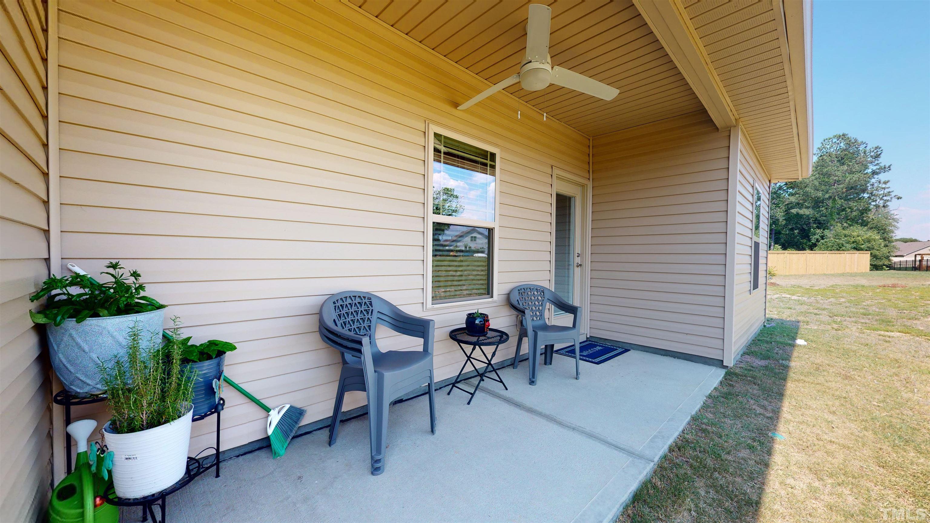 96 Longo Lane Benson, NC 27504 - Photo 39 of 51 a view of a patio with chair and potted plants