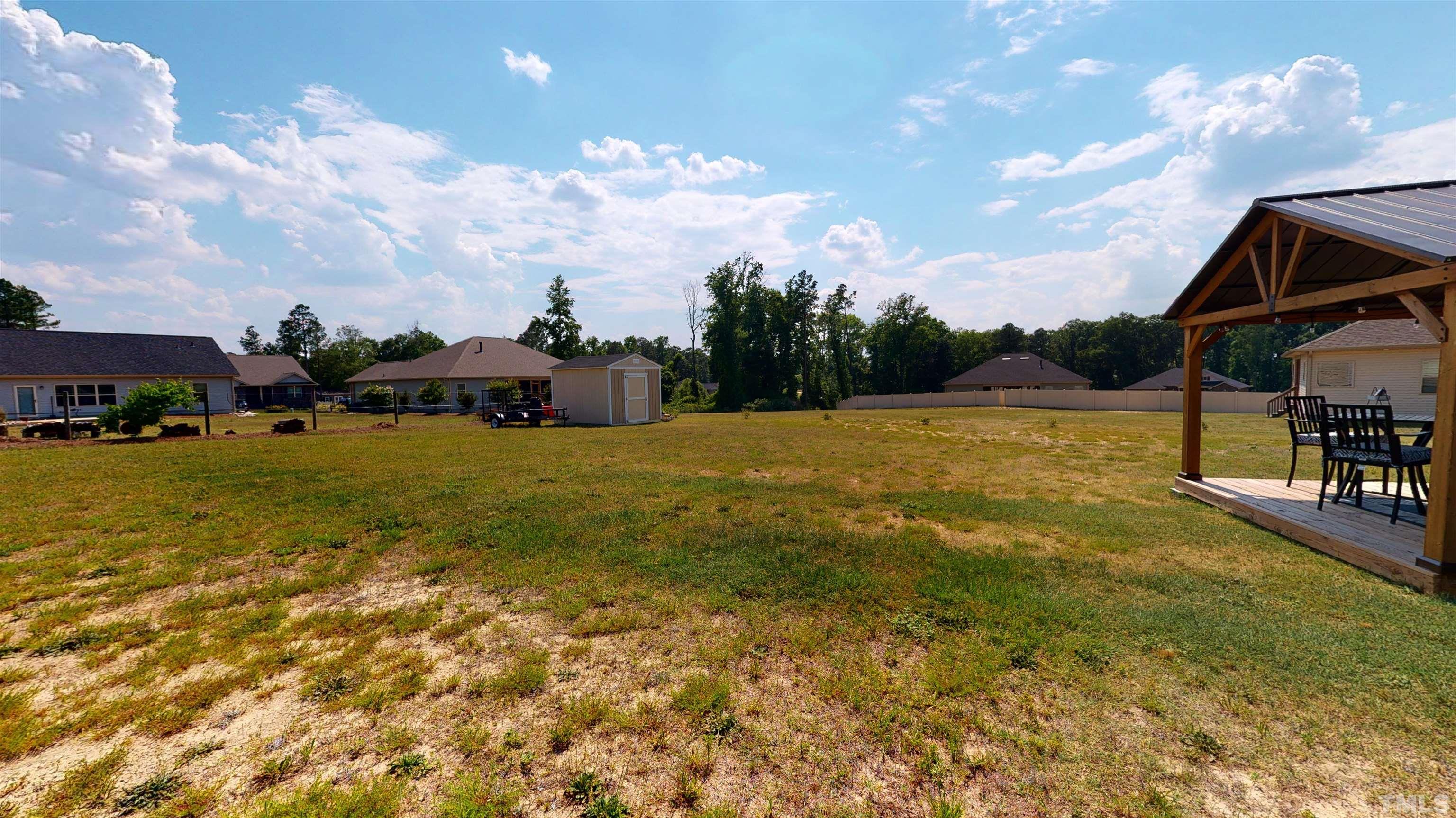 96 Longo Lane Benson, NC 27504 - Photo 49 of 51 a view of yard with swimming pool and seating