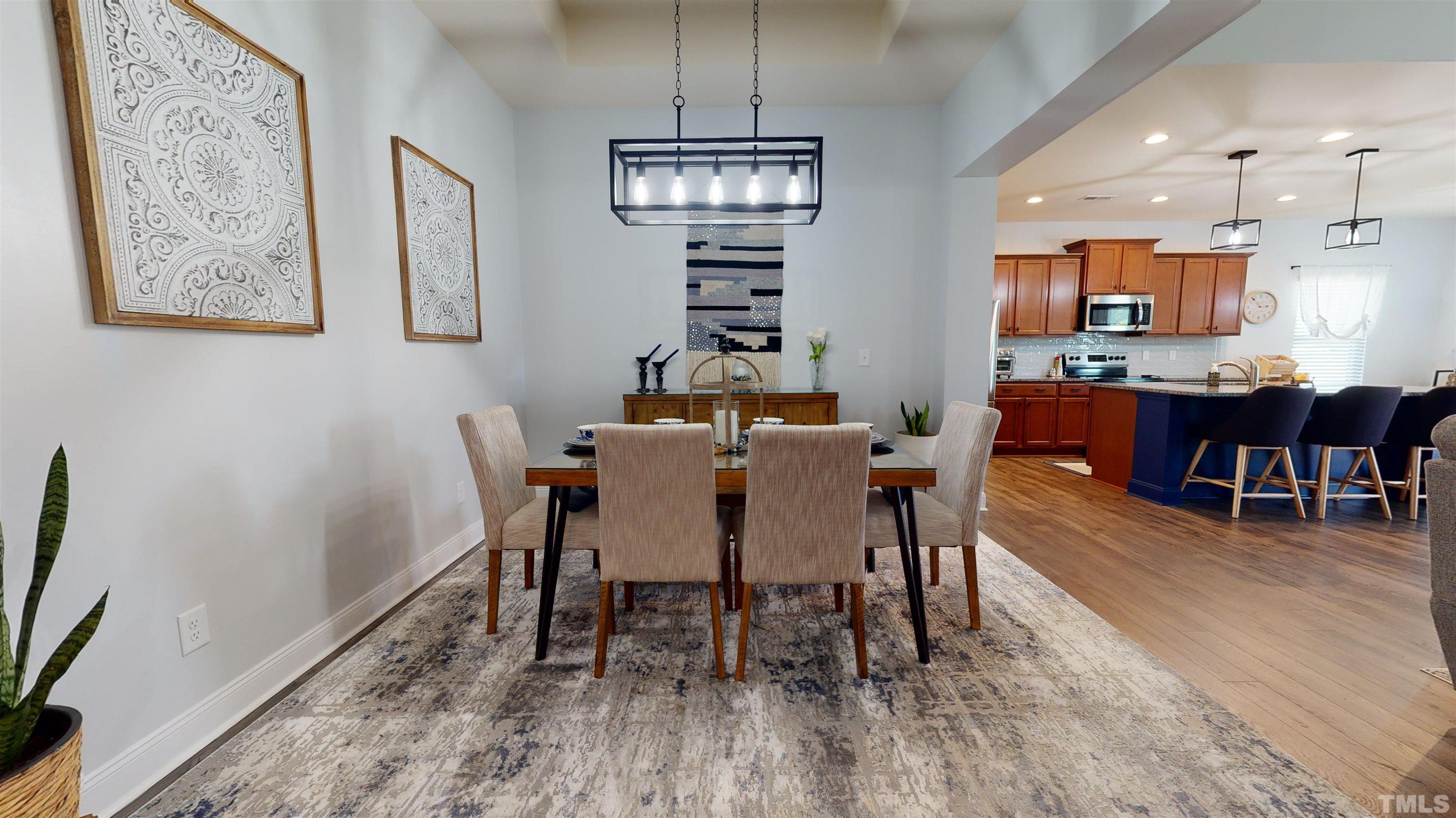 96 Longo Lane Benson, NC 27504 - Photo 7 of 51 a view of a dining room with furniture window and wooden floor