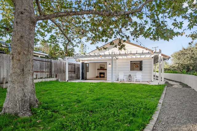 a view of chair and wooden fence