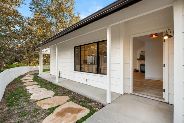 a front view of a house with a large window