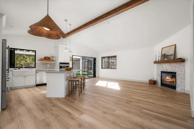 a view of a livingroom with furniture and a fireplace