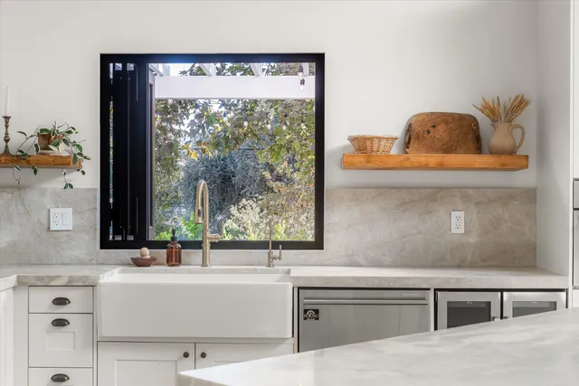 a living room with granite countertop furniture and a window