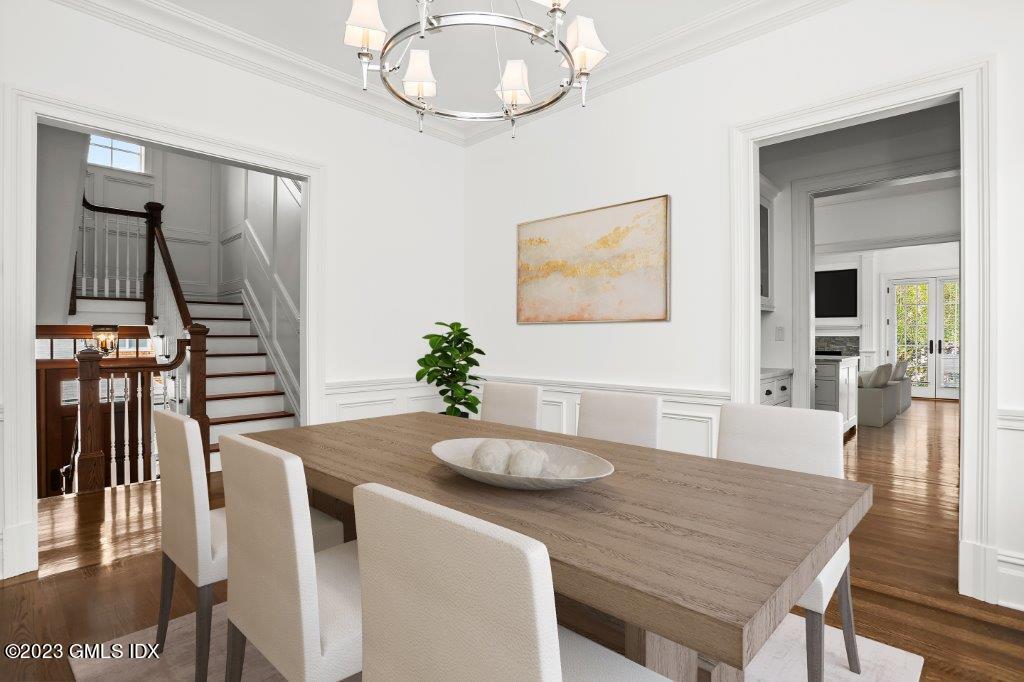 24 Orchard Place, Unit A Greenwich, CT 06830 - Photo 6 of 15 a dining room with furniture and wooden floor