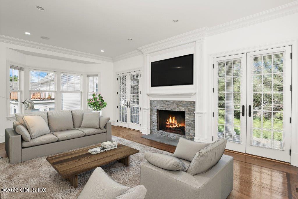 24 Orchard Place, Unit A Greenwich, CT 06830 - Photo 10 of 15 a living room with furniture fireplace and a flat screen tv
