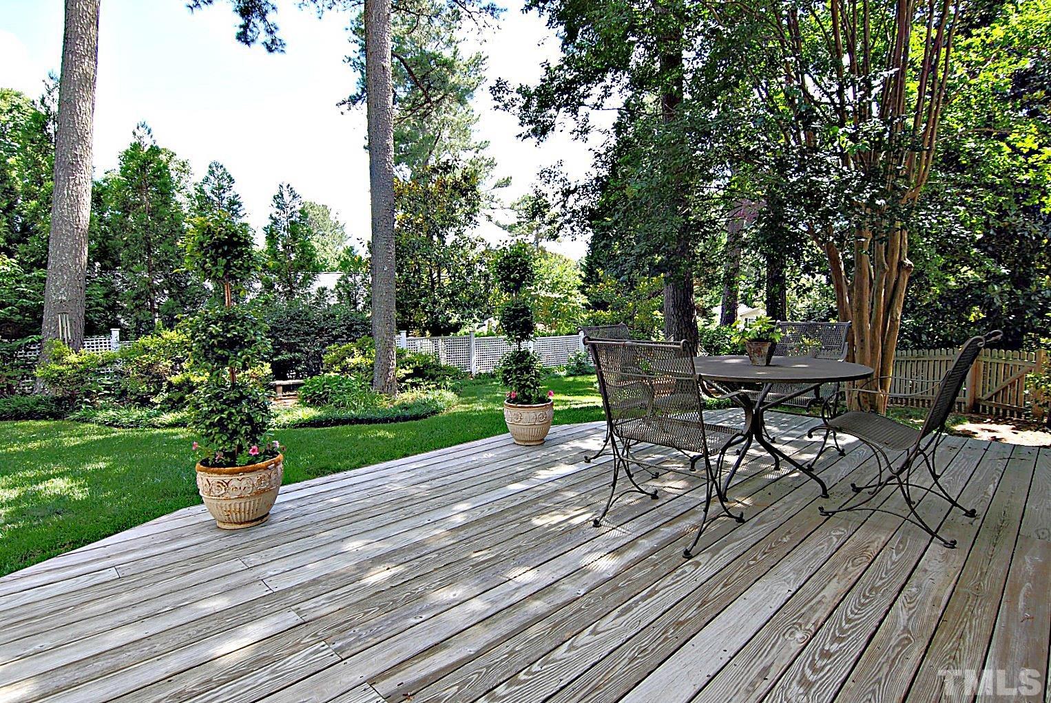 407 Foxhall Street Raleigh, NC 27609 - Photo 27 of 28 a lawn chairs sitting on a wooden deck with a yard
