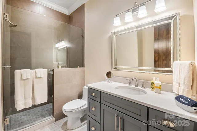 a living room with furniture and large windows