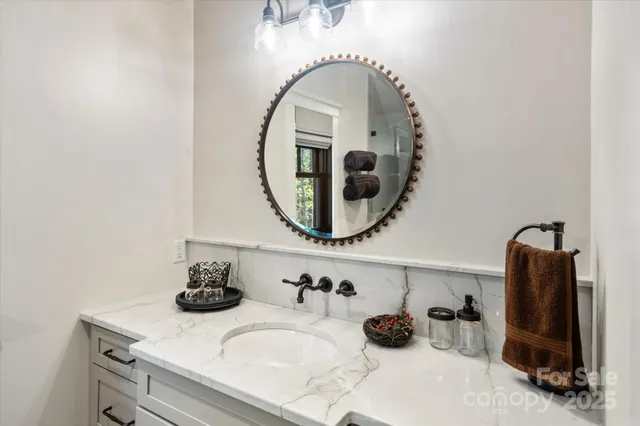 a spacious bedroom with a bed and ceiling fan