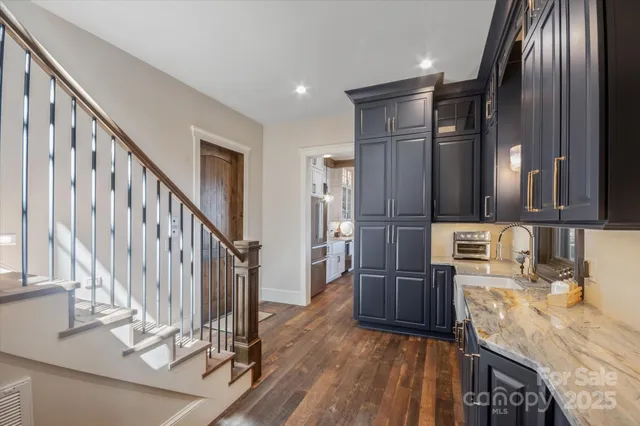a kitchen with cabinets a sink and appliances